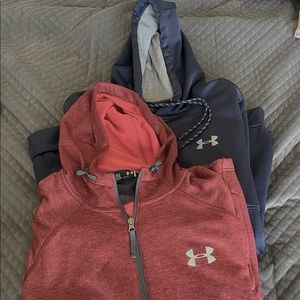 Pair of UA pullovers